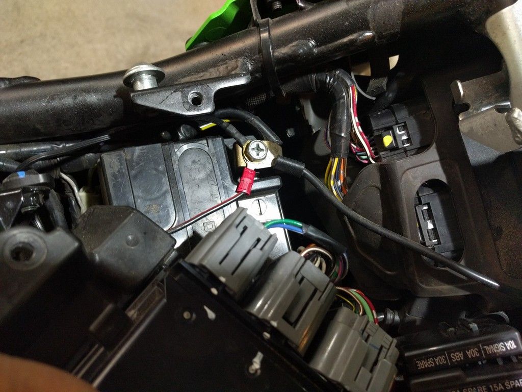 You can see the positive pigtail routed to the rear of the bike. The inline fuse of the pigtail is tucked under the bike's fuse box.